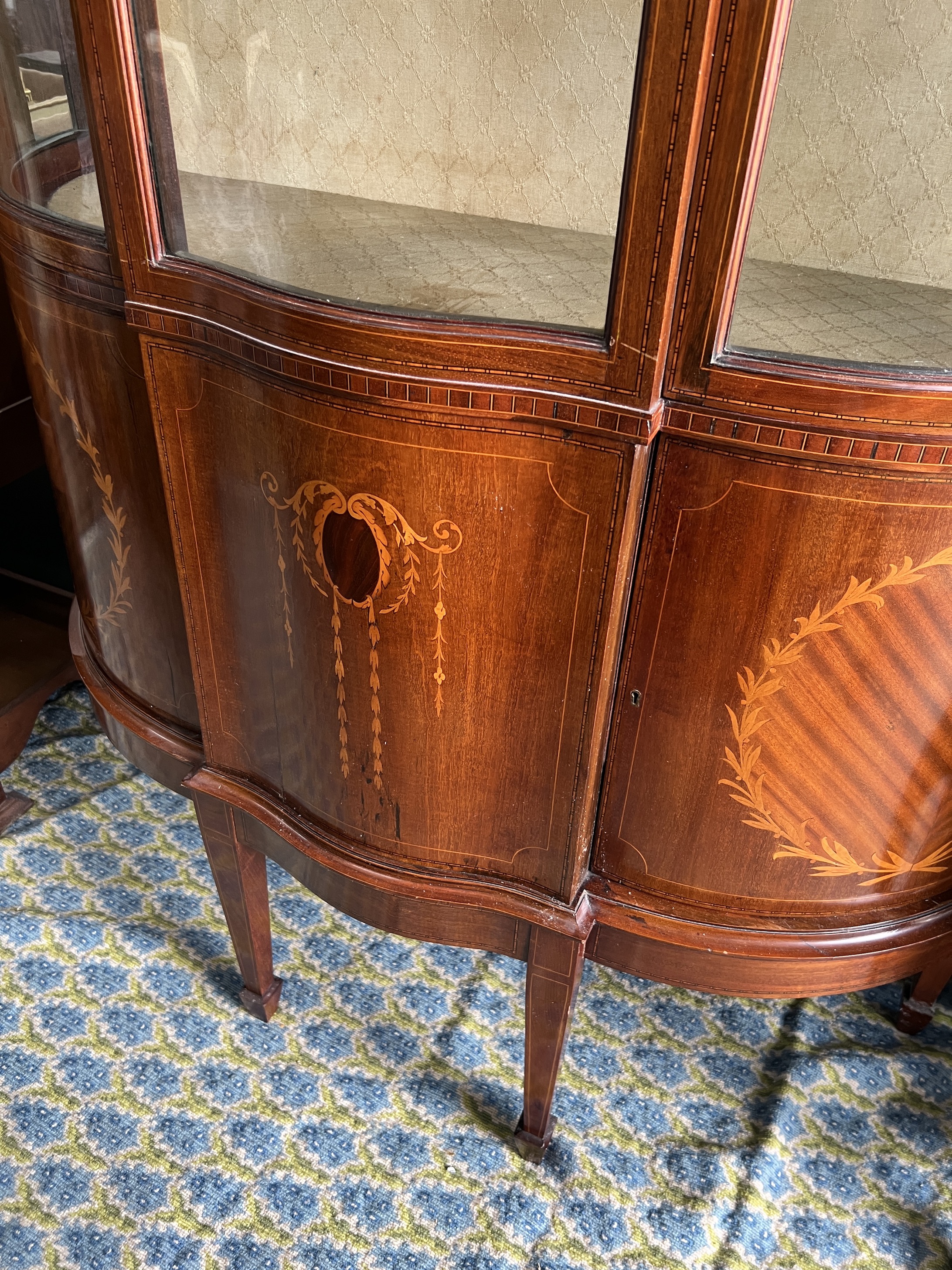 An Edwardian marquetry inlaid mahogany bowfront display cabinet, width 118cm, depth 48cm, height 185cm
